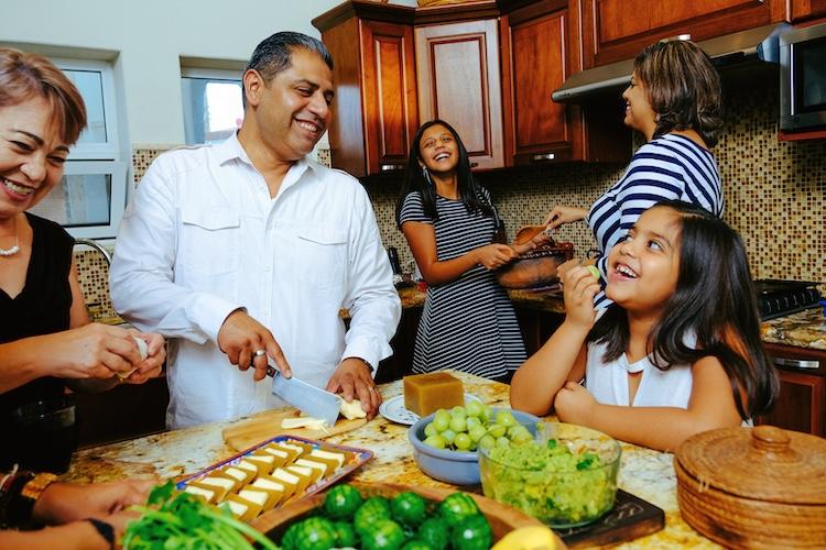 family cooking together in ktichen