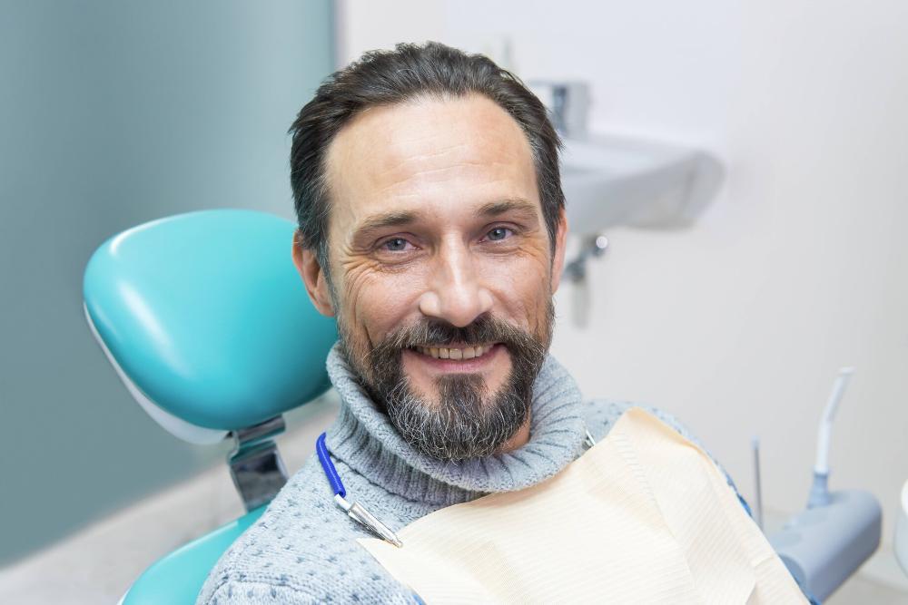man smiling in dental chair