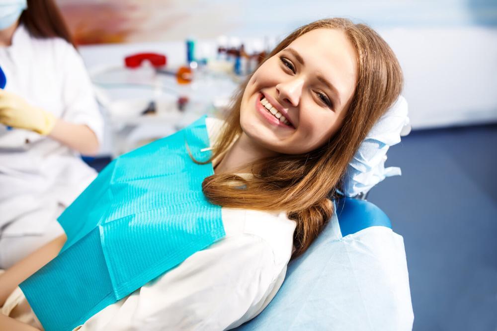 woman smiling in dental chair during exam in toronto
