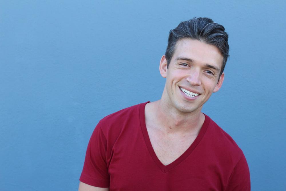 man smiling with blue background