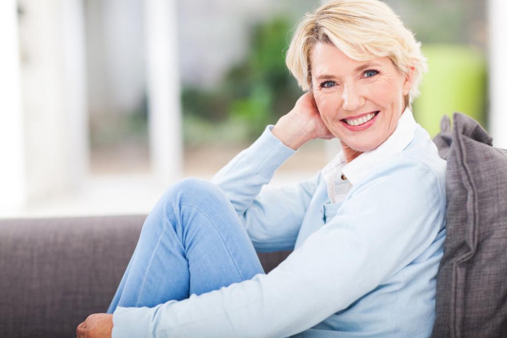 woman smiling after getting dental implants