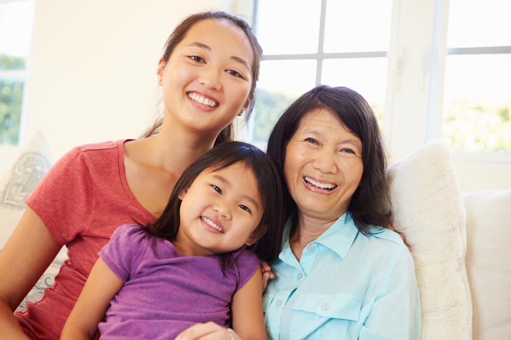 Family of three smiling in etobicoke