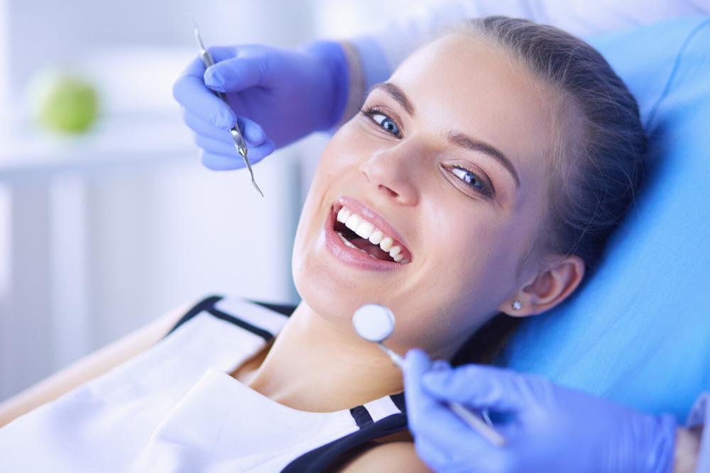 woman smiling after getting a dental checkup