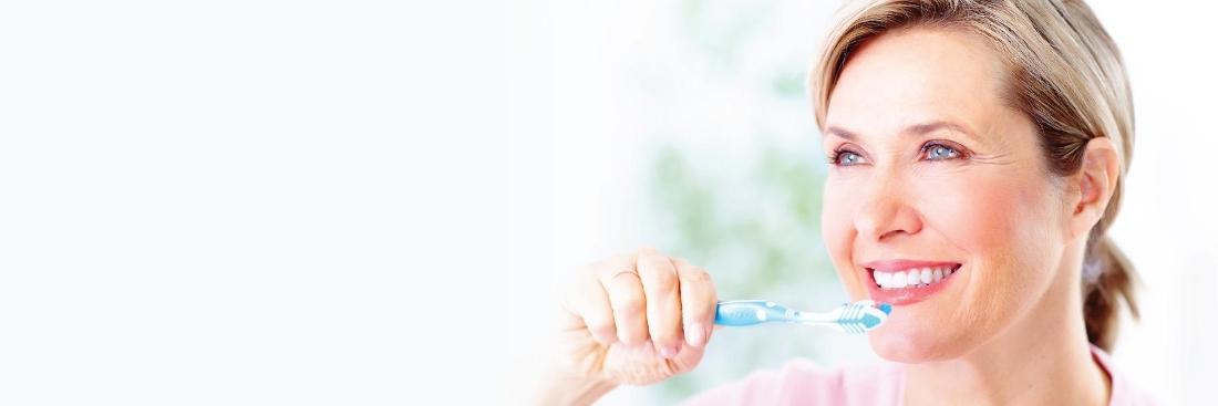 close up of etobicoke woman brushing teeth