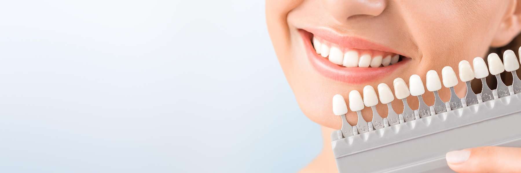 woman choosing tooth shade for teeth whitening in etobicoke