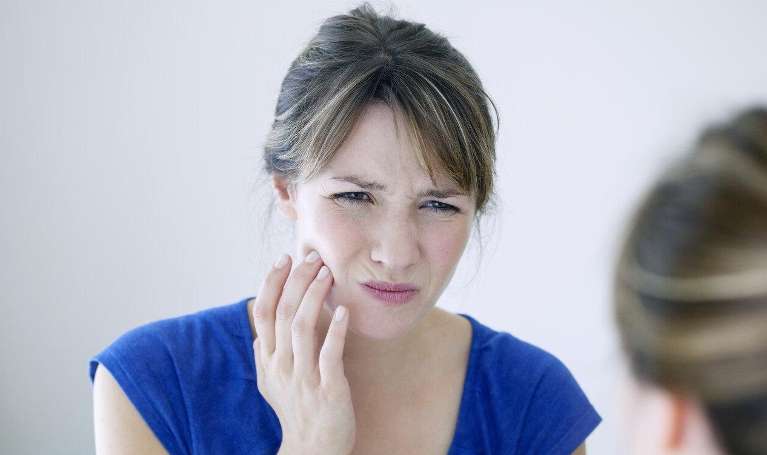 Woman With Jaw Pain