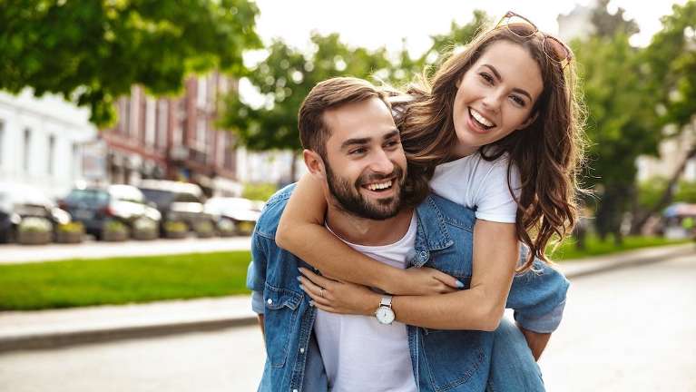 man and woman smiling 