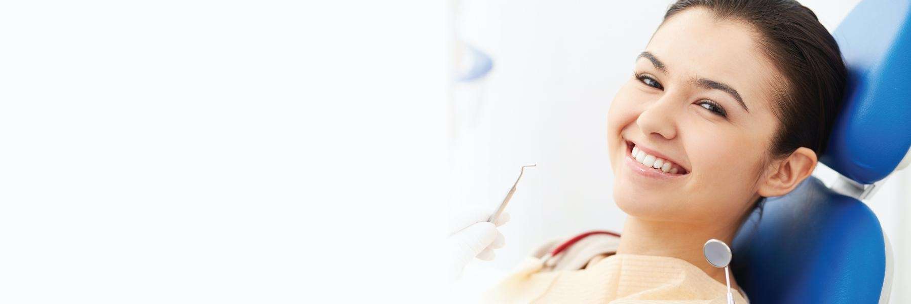woman smiling after dental visit at toronto lakeshore dental