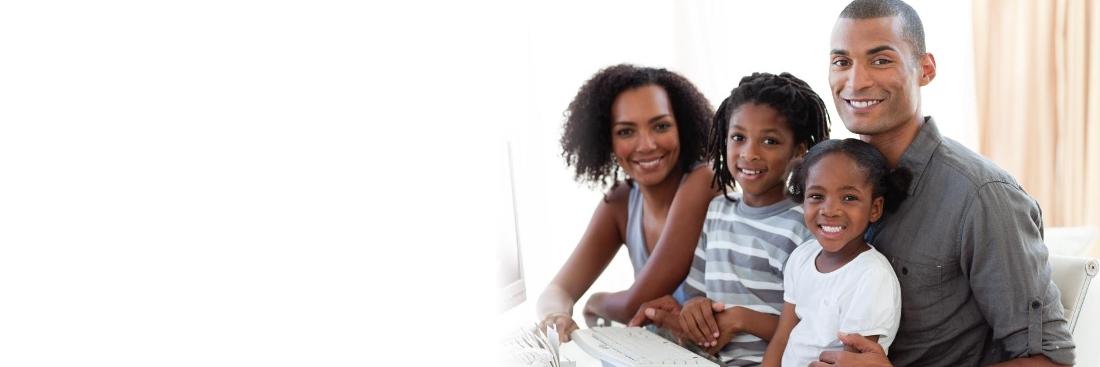 family of four smiling