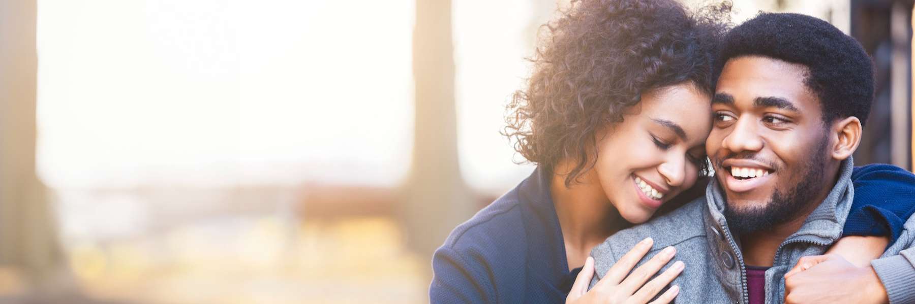 man and woman hugging