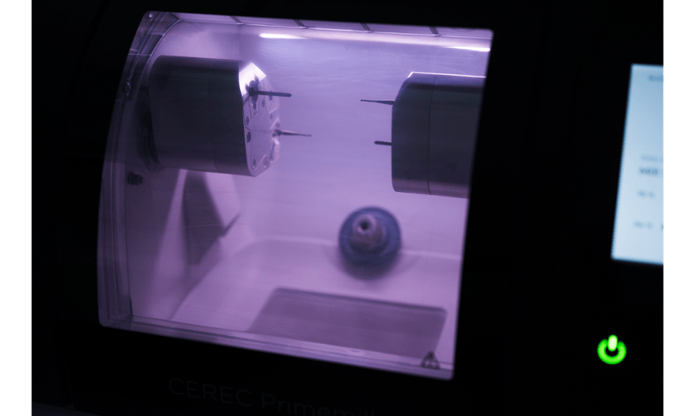 Close-up of CEREC milling technology used for same-day dental restorations in etobicoke