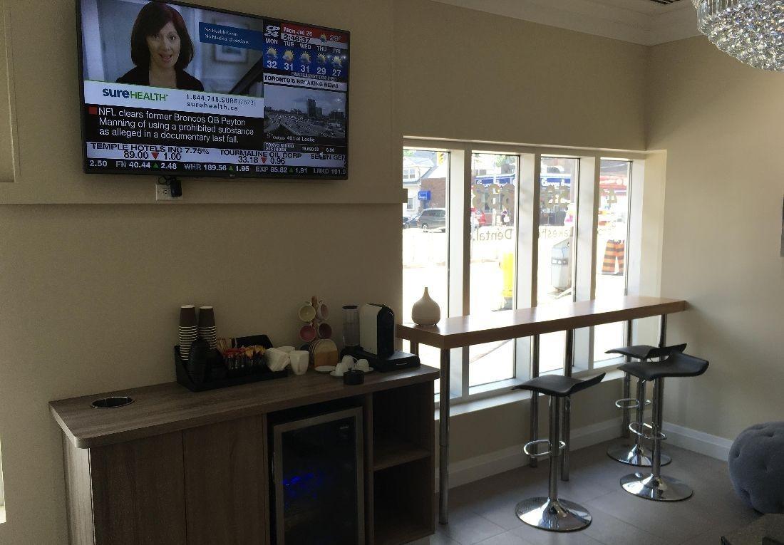 Coffee Bar + Seating Area Coffee Bar + Seating Area with tv at Toronto Lakeshore Dental