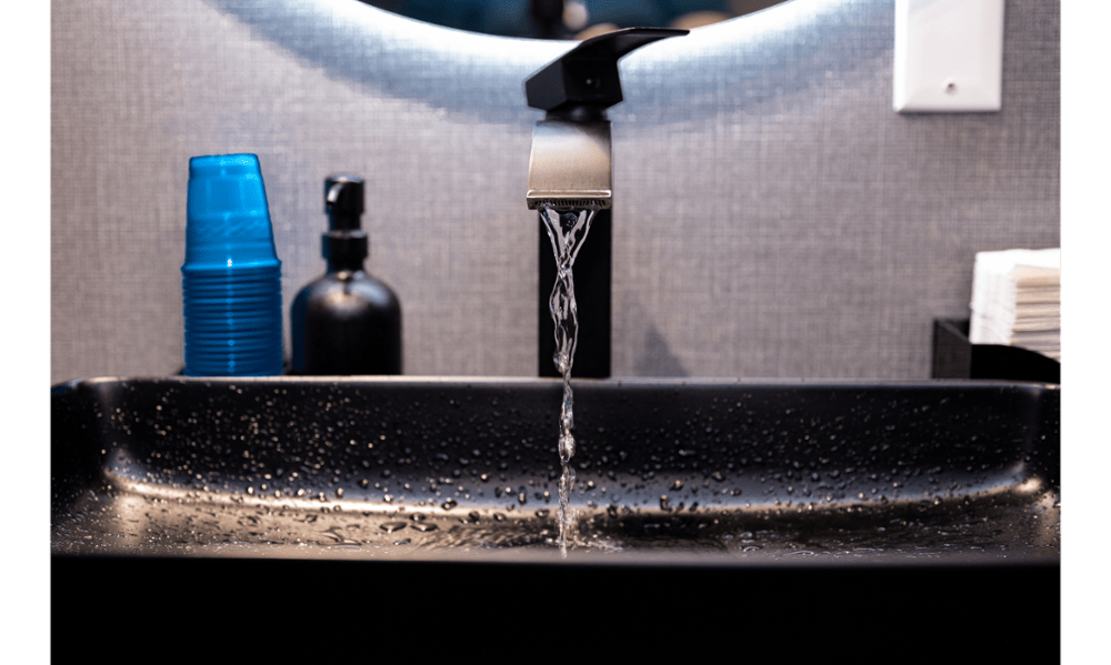 Modern black sink and faucet inside Toronto Lakeshore Dental